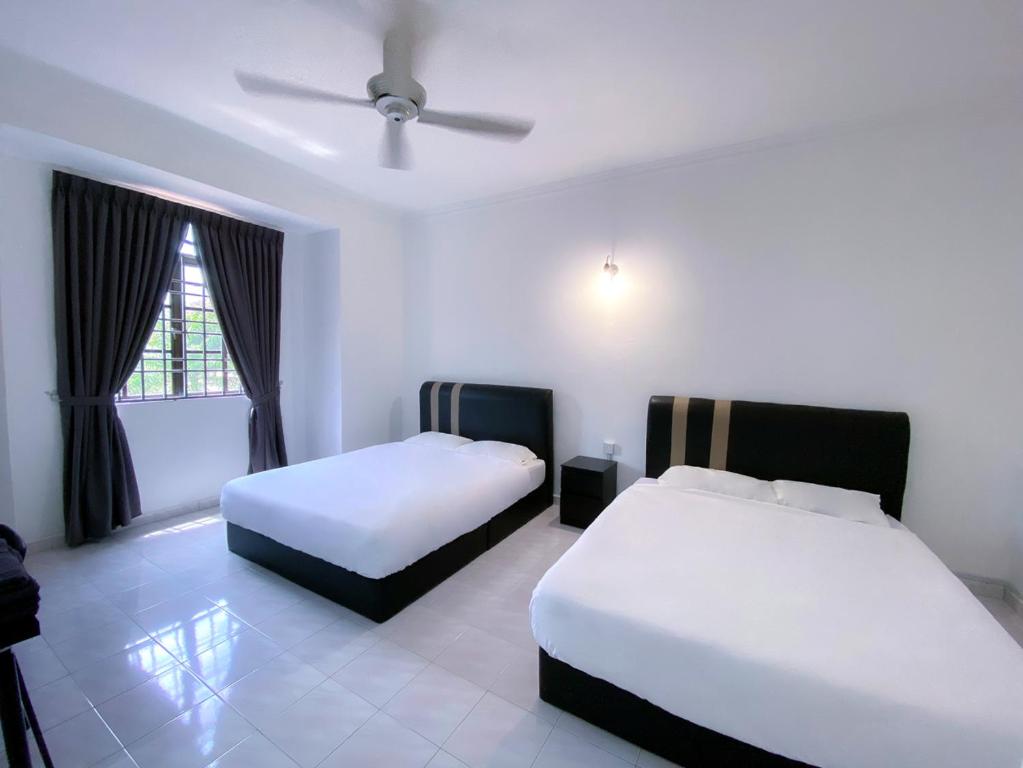 Voodi või voodid majutusasutuse Venice Guest Hostel - Bilik Sahaja toas