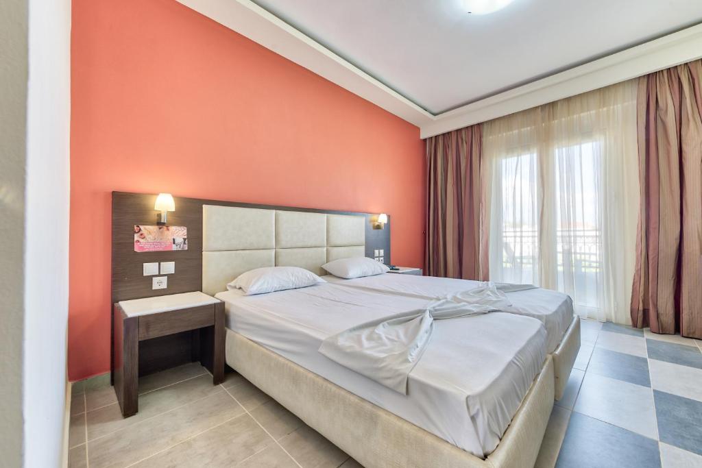 Postel nebo postele na pokoji v ubytování Majestic Hotel & Spa
