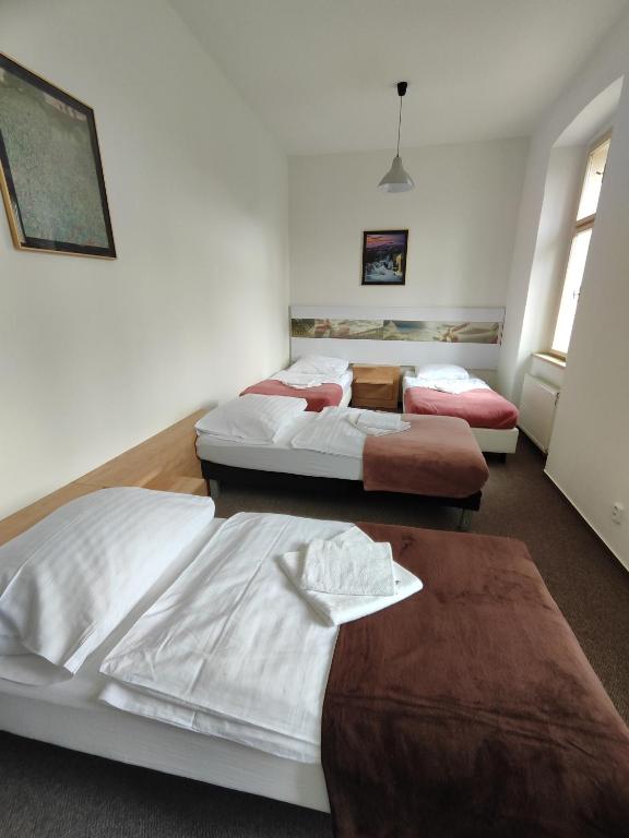 Postel nebo postele na pokoji v ubytování Hotel Stará Škola