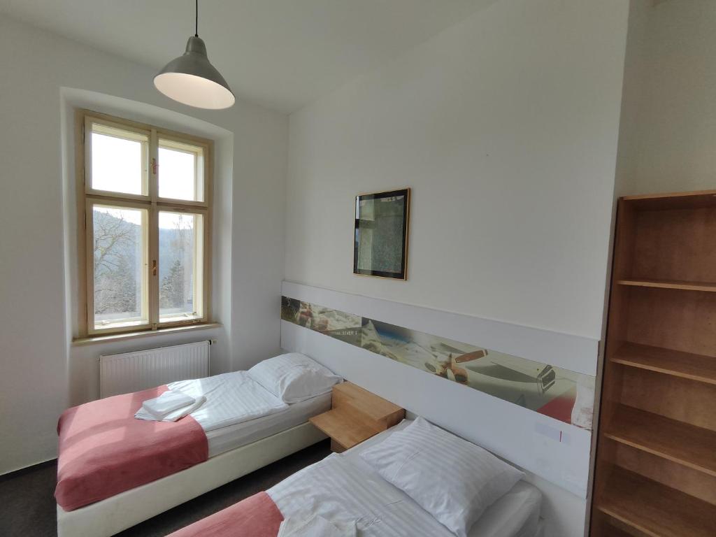 Postel nebo postele na pokoji v ubytování Hotel Stará Škola