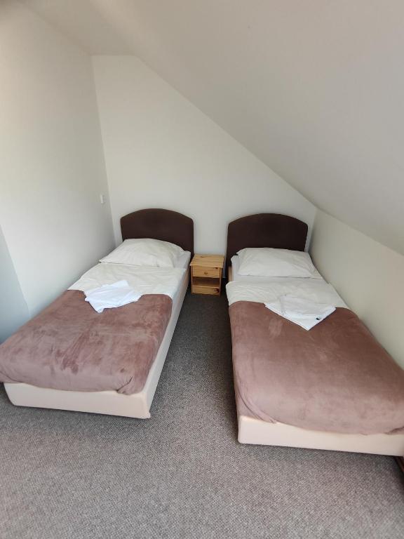 Postel nebo postele na pokoji v ubytování Hotel Stará Škola