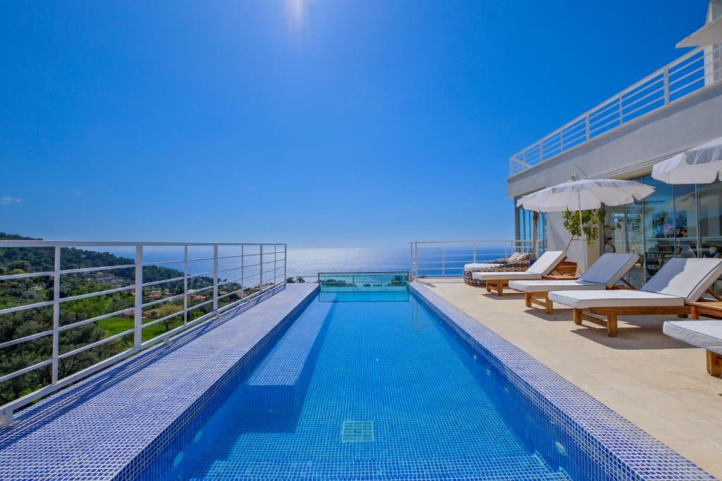 a swimming pool on the roof of a building at Highclere Hotel and Spa in Faralya