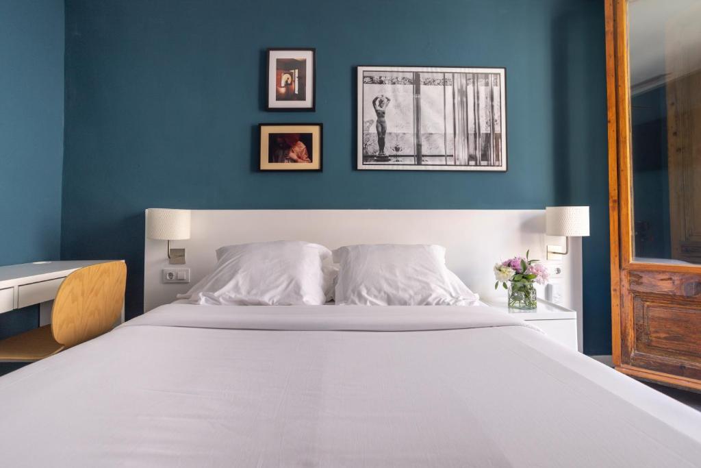 Postel nebo postele na pokoji v ubytování Hostal Sol y K
