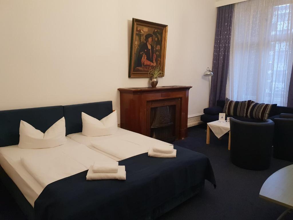 Postel nebo postele na pokoji v ubytování Hotel Seifert Berlin am Kurfürstendamm