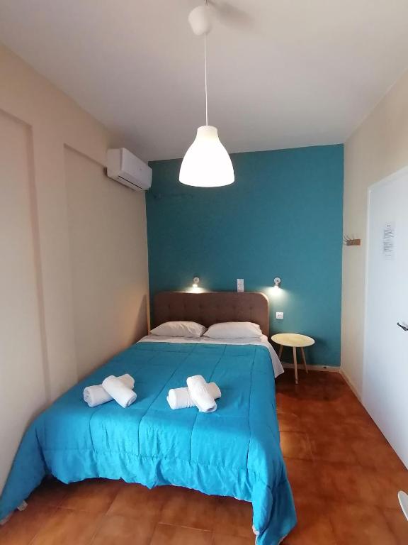 Postel nebo postele na pokoji v ubytování Perdika Mare Guesthouse
