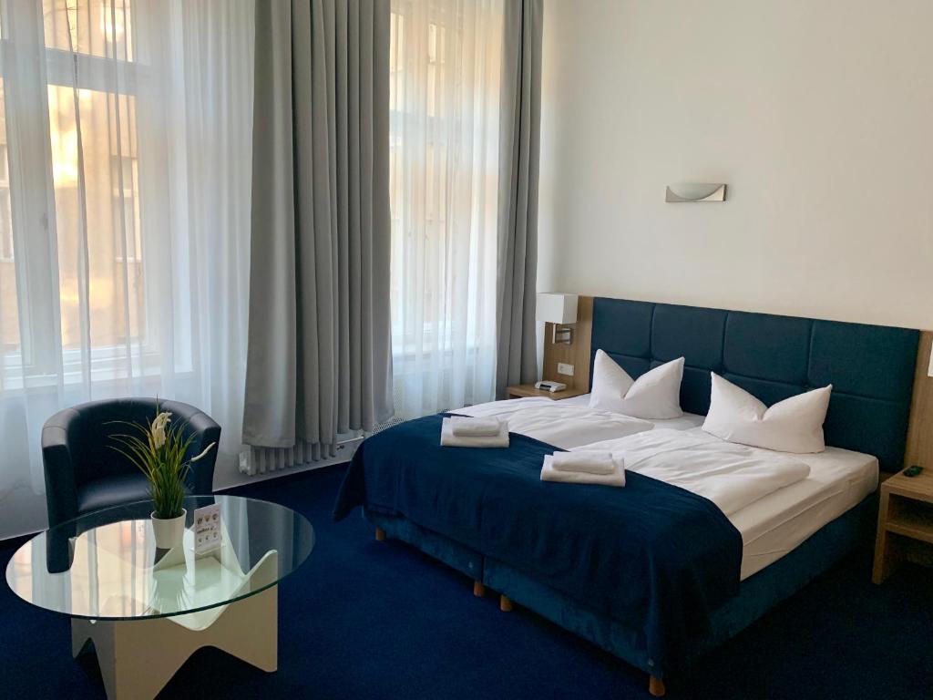 Postel nebo postele na pokoji v ubytování Hotel Seifert Berlin am Kurfürstendamm