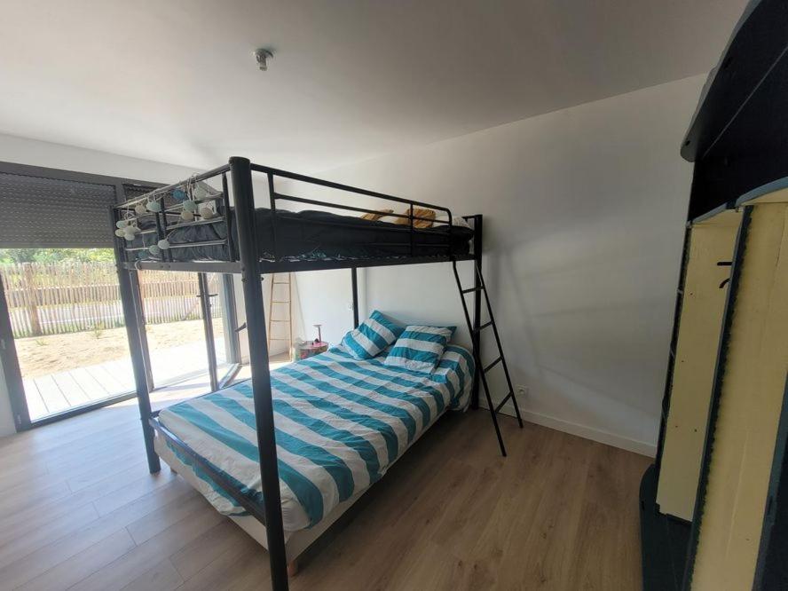 Posteľ alebo postele v izbe v ubytovaní JOLIE MAISON BOIS 8 à 10 personnes