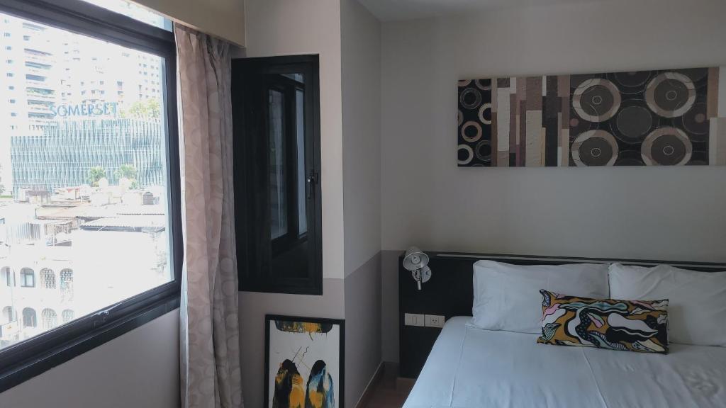 Postel nebo postele na pokoji v ubytování Twenty Three Residence
