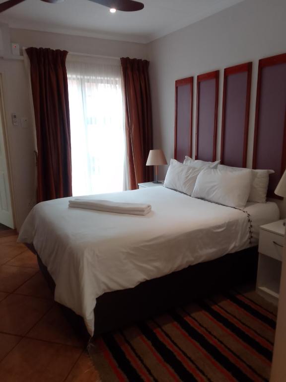 Postel nebo postele na pokoji v ubytování Botleng Guest House