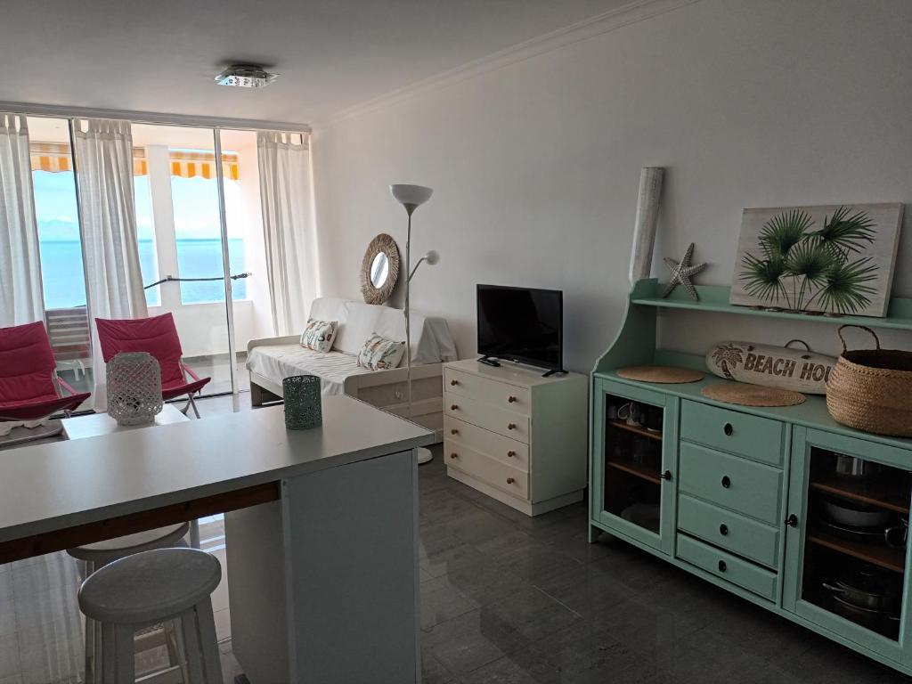 A television and/or entertainment centre at Great oportunity Costa Adeje Holiday apartment first sea line Free Wifi