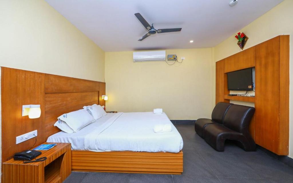 Postel nebo postele na pokoji v ubytování Pearl Park Beach Resort Private Limited
