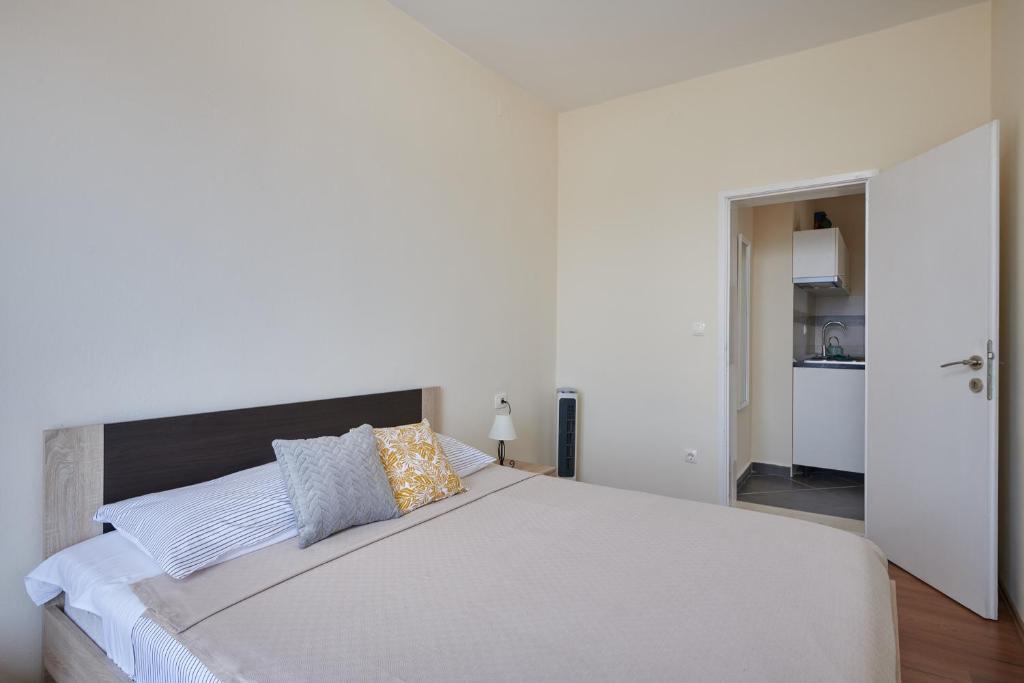 Posteľ alebo postele v izbe v ubytovaní Dubrovnik View Apartments