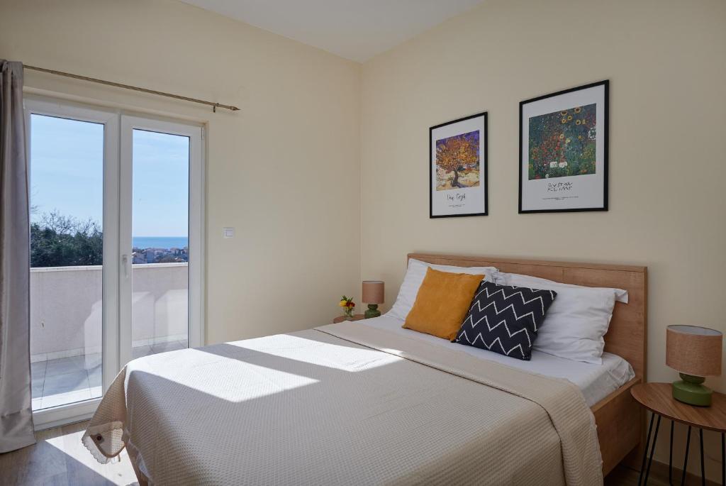 Posteľ alebo postele v izbe v ubytovaní Dubrovnik View Apartments