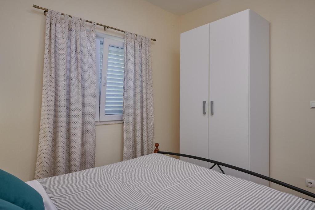 Posteľ alebo postele v izbe v ubytovaní Dubrovnik View Apartments