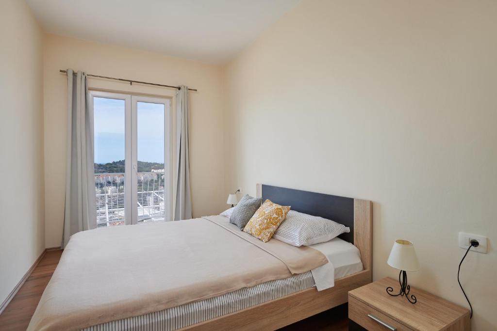 Posteľ alebo postele v izbe v ubytovaní Dubrovnik View Apartments