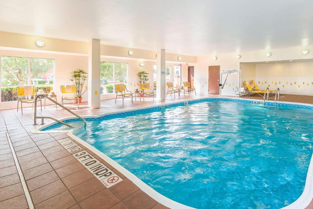 a large swimming pool in a hotel room at Fairfield Inn & Suites Dallas Park Central in Dallas