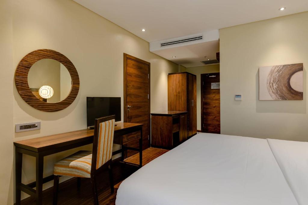 Postel nebo postele na pokoji v ubytování Protea Hotel by Marriott Ikeja Select
