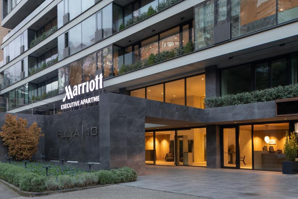 a building with a sign on the side of it at Marriott Executive Apartments Istanbul Fulya in Istanbul