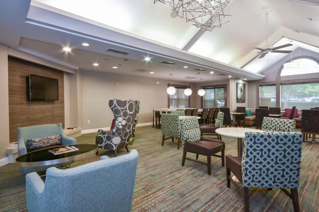a lobby with chairs and a waiting room at Residence Inn by Marriott Lake Norman in Huntersville