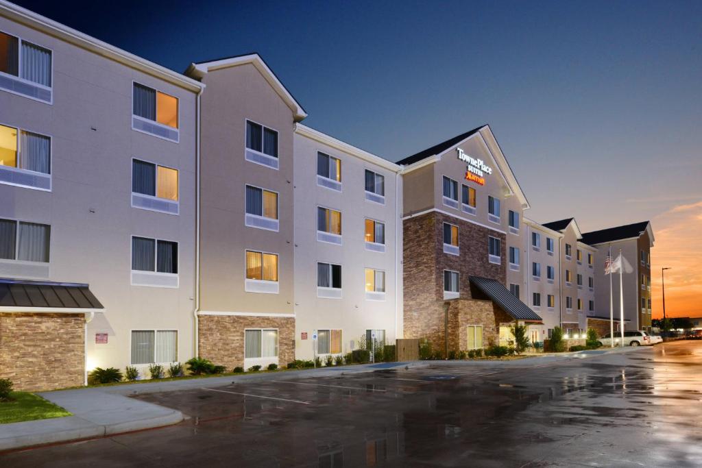 a rendering of a hotel with a parking lot at TownePlace Suites by Marriott Houston Galleria Area in Houston
