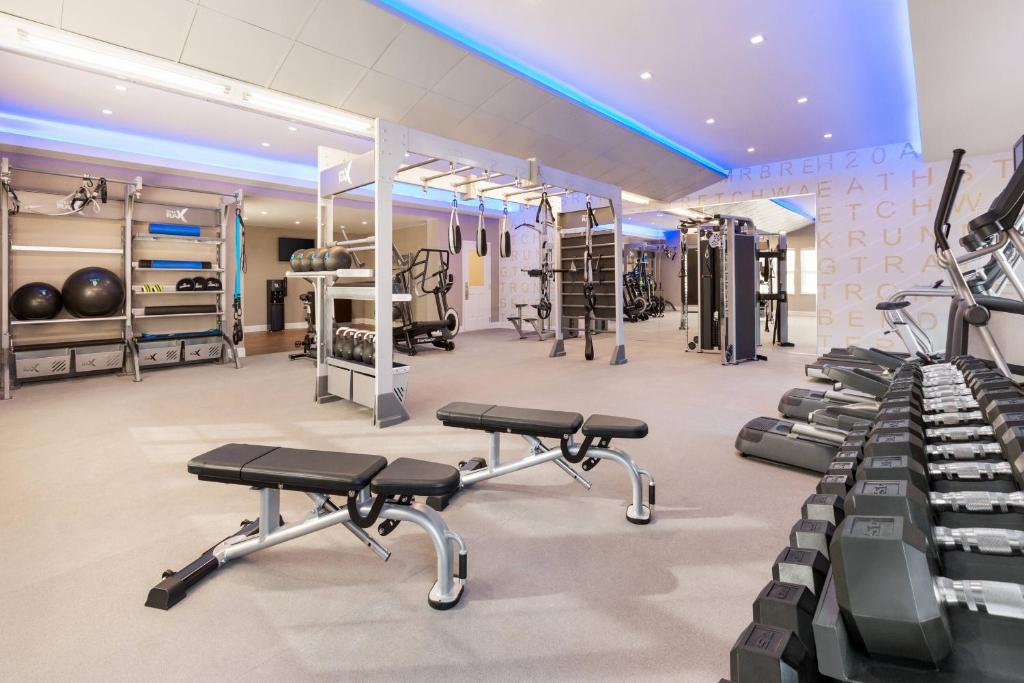a gym with treadmills and exercise bikes in it at Residence Inn Deptford in Almonesson
