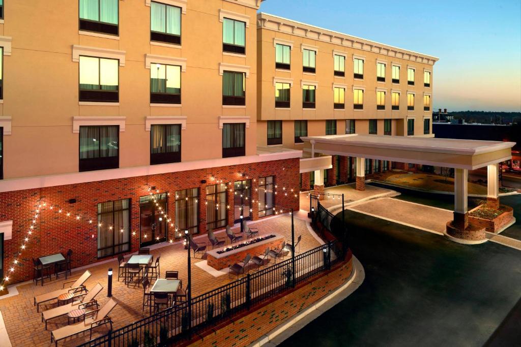 a hotel with a patio and a building at Courtyard by Marriott LaGrange in La Grange