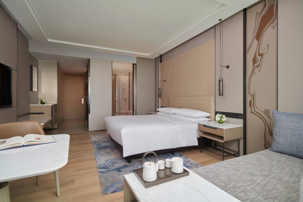 Postel nebo postele na pokoji v ubytování Fuzhou Marriott Hotel Riverside