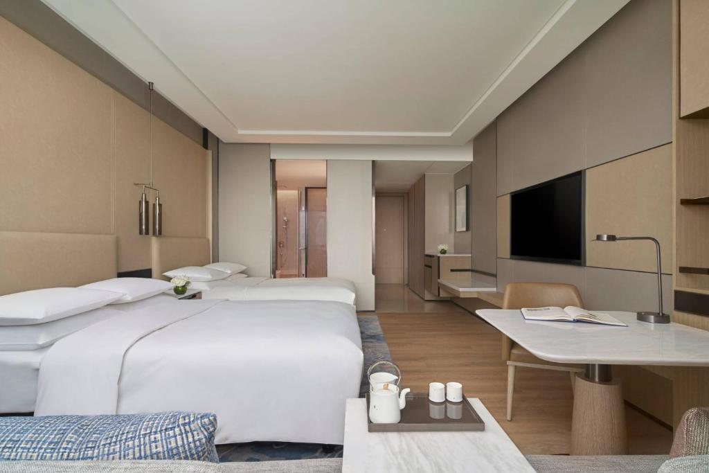 Postel nebo postele na pokoji v ubytování Fuzhou Marriott Hotel Riverside