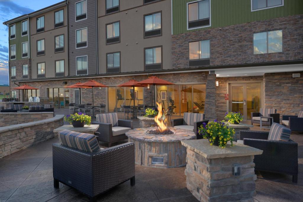 a hotel patio with a fire pit in front of a building at TownePlace Suites by Marriott Denver South/Lone Tree in Lone Tree