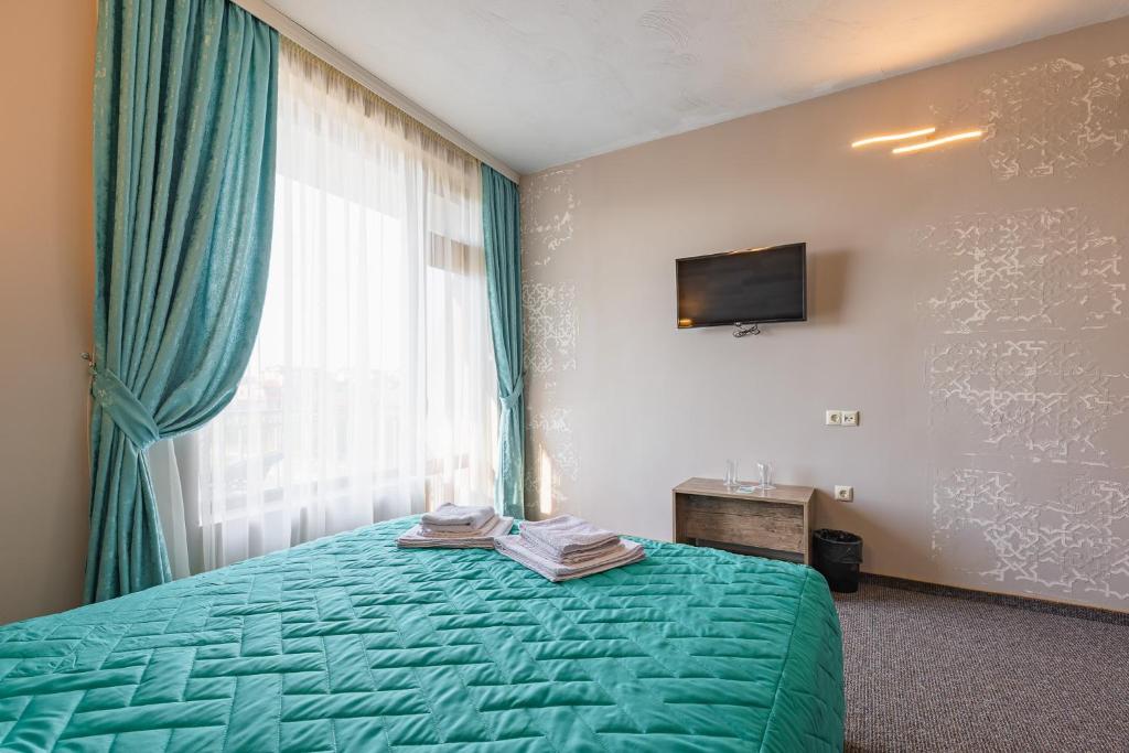 TV a/nebo společenská místnost v ubytování Lecardo Hotel