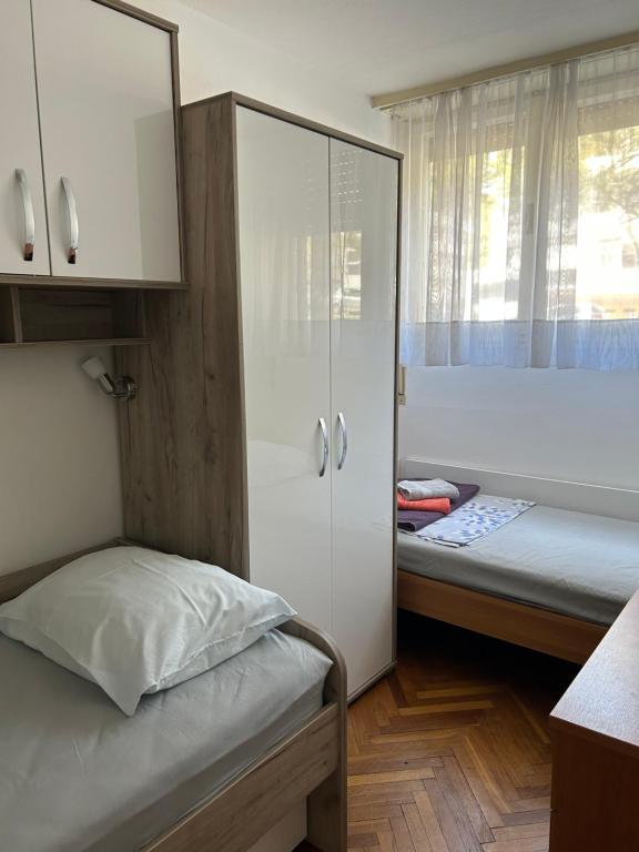 Posteľ alebo postele v izbe v ubytovaní City Apartment Sonya