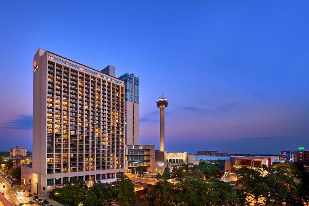 a city skyline with a tall building and a tower at San Antonio Marriott Riverwalk in San Antonio