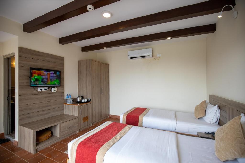 Postel nebo postele na pokoji v ubytování Gateway Himalaya Resort