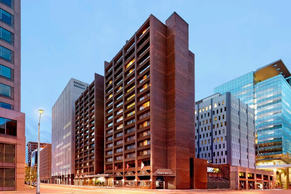 a rendering of a tall building in a city at Sheraton Ottawa Hotel in Ottawa