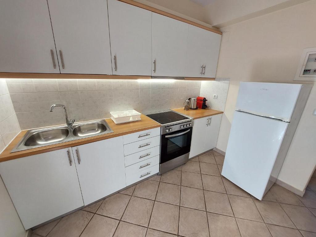 Kuchyň nebo kuchyňský kout v ubytování Villaaltinaapartments