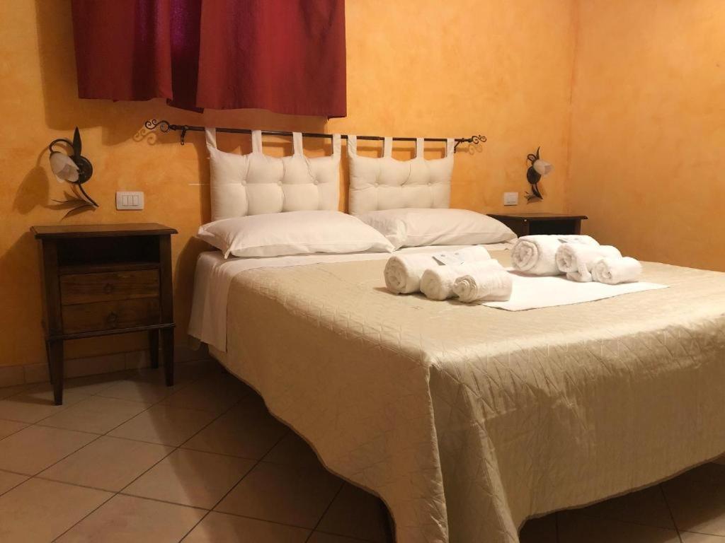 Postel nebo postele na pokoji v ubytování L’attico Piazza Sant’Oronzo