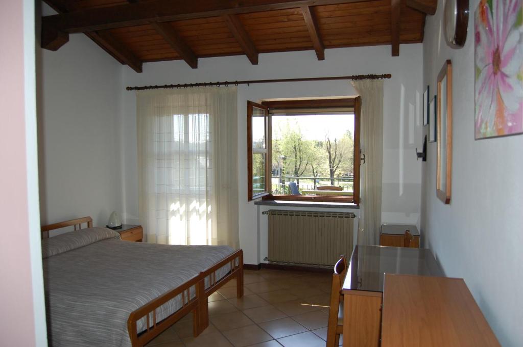 Postel nebo postele na pokoji v ubytování B&B Il Gufetto