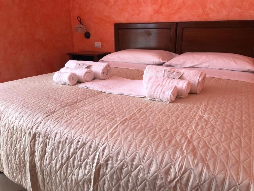 Postel nebo postele na pokoji v ubytování L’attico Piazza Sant’Oronzo
