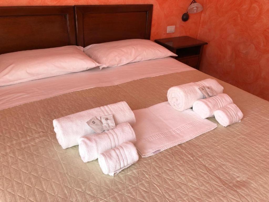 Postel nebo postele na pokoji v ubytování L’attico Piazza Sant’Oronzo