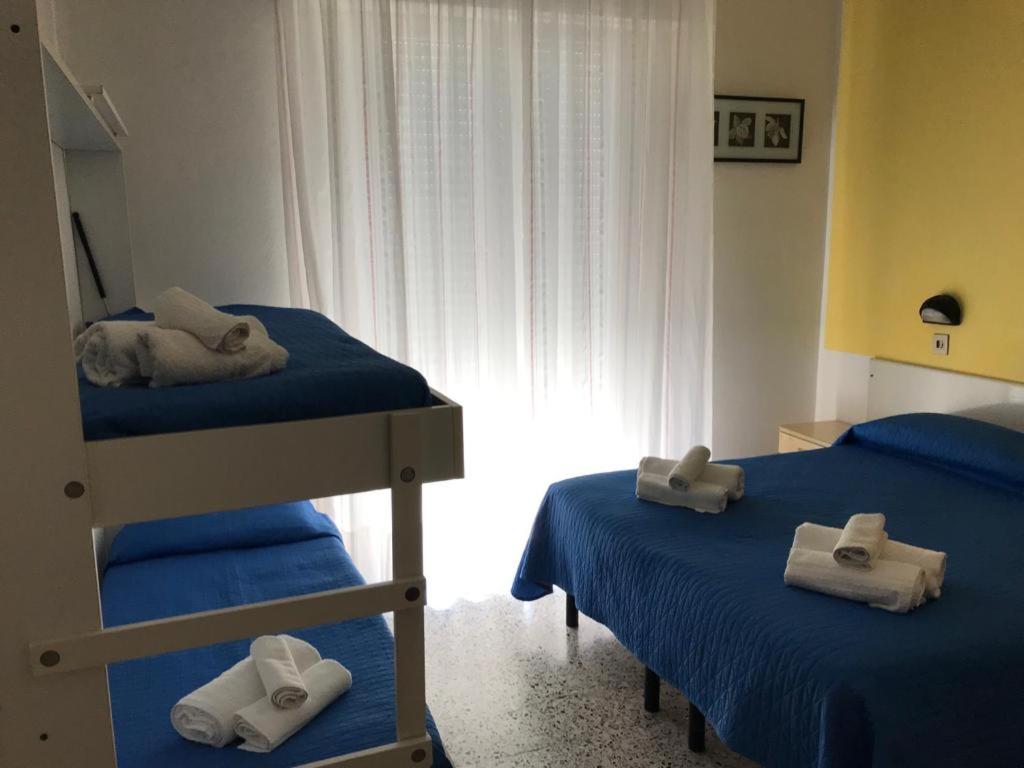 Łóżko lub łóżka w pokoju w obiekcie Hotel Perla Verde