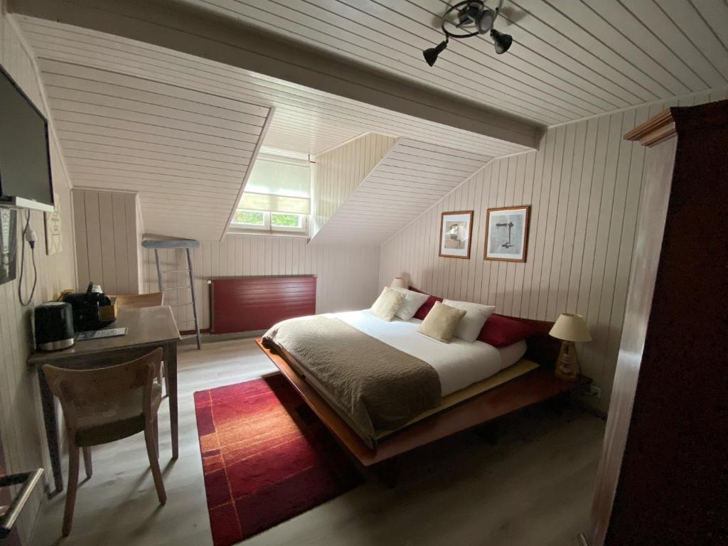 Postel nebo postele na pokoji v ubytování B&B Restaurant Le Pernollet