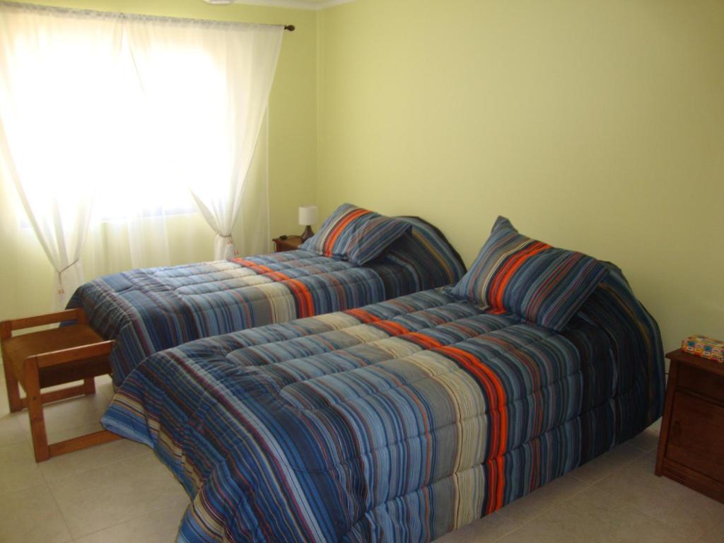 Una cama o camas en una habitación de Tralka B&B