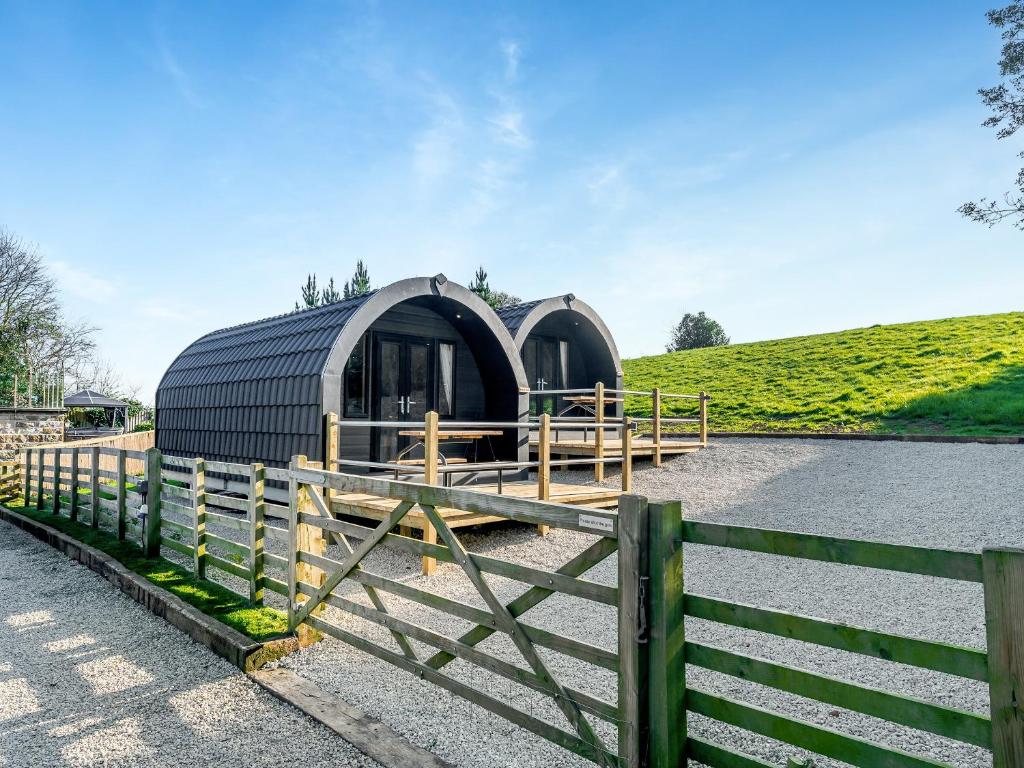 a black dome shaped building next to a fence at Farm View - Uk43708 in Cloughton