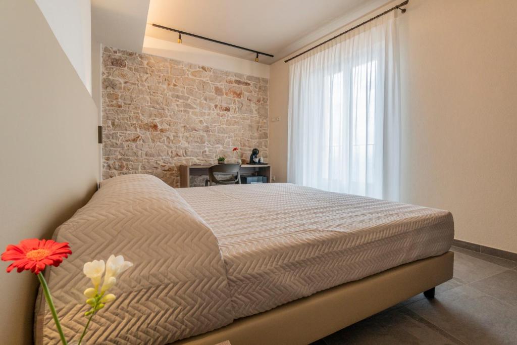Postel nebo postele na pokoji v ubytování Goloritzè Room and Breakfast