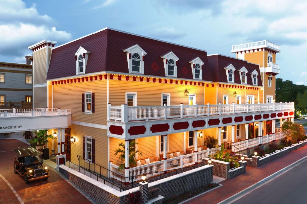 a large yellow building with a gambrel roof at Renaissance St. Augustine Historic Downtown Hotel in St. Augustine