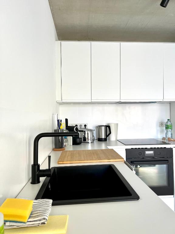 Kuchyň nebo kuchyňský kout v ubytování Weinberg-Design-Apartment Stuttgart-Fellbach