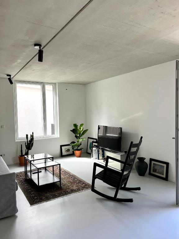 Posezení v ubytování Weinberg-Design-Apartment Stuttgart-Fellbach