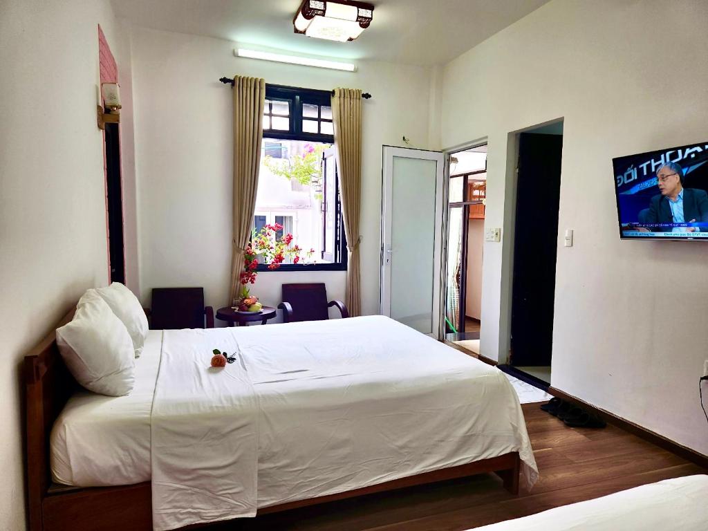 Postel nebo postele na pokoji v ubytování Anh Family Homestay