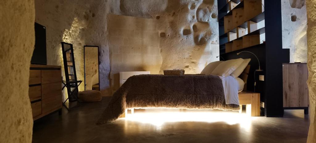 Łóżko lub łóżka w pokoju w obiekcie Grotta Barisano