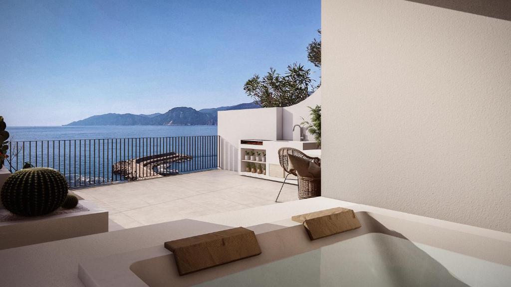 a living room with a view of the ocean at Seaview House Cala Gonone in Cala Gonone